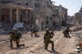 Israeli army soldiers in the devastated Gaza